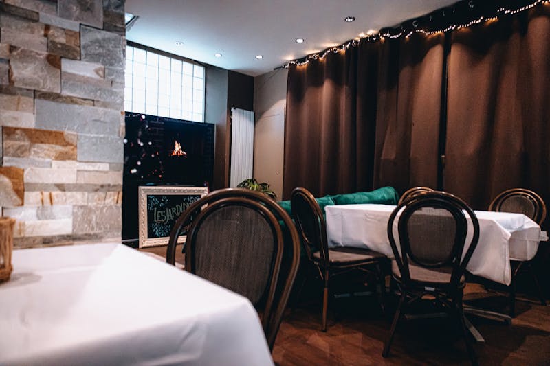 Family feast with multiple pizzas and sides